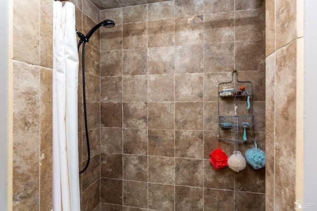 full bath featuring a tile shower