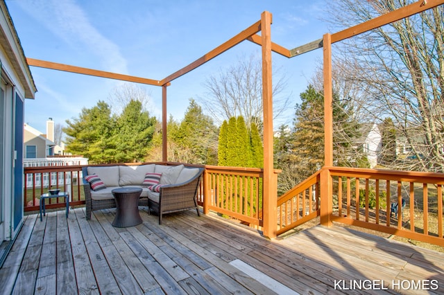 wooden deck featuring outdoor lounge area