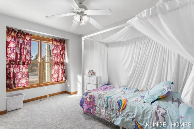 carpeted bedroom featuring visible vents, baseboards, and ceiling fan