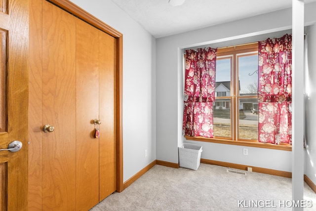 bedroom with carpet flooring, visible vents, and baseboards