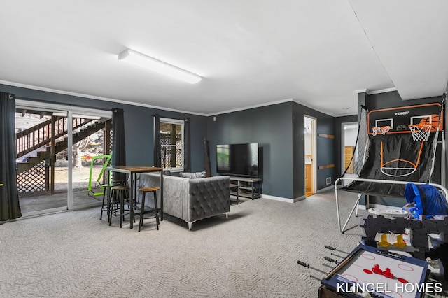 living room featuring carpet floors, baseboards, and ornamental molding