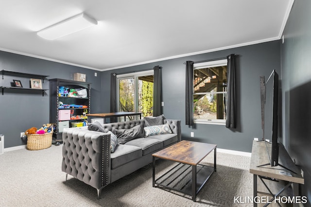 carpeted living room featuring crown molding and baseboards