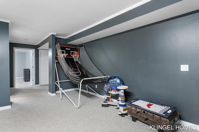 workout area with baseboards, carpet floors, and crown molding