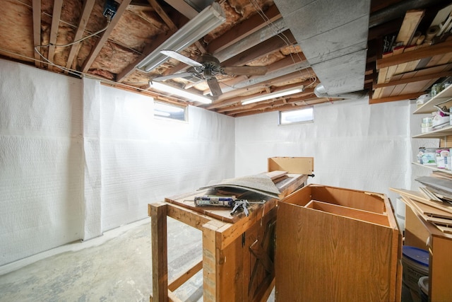 basement featuring a ceiling fan