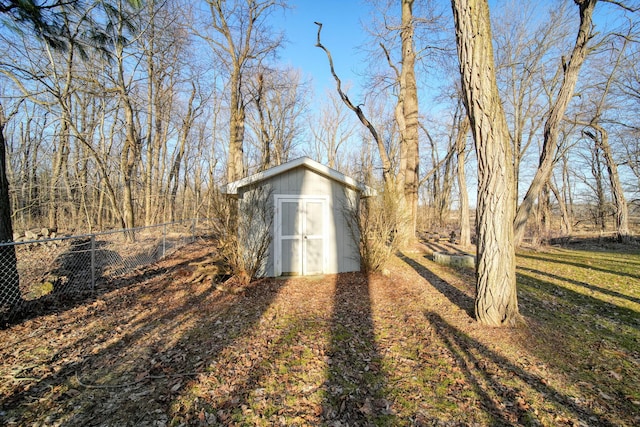 view of shed with fence