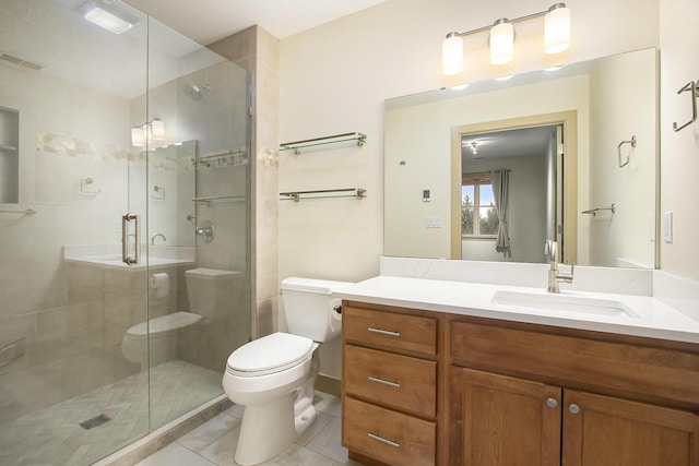 full bath featuring tile patterned flooring, a shower stall, toilet, and vanity