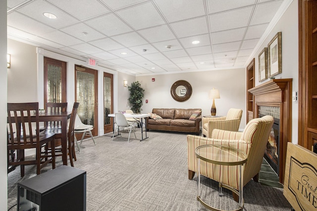 living room with recessed lighting, carpet floors, and a fireplace