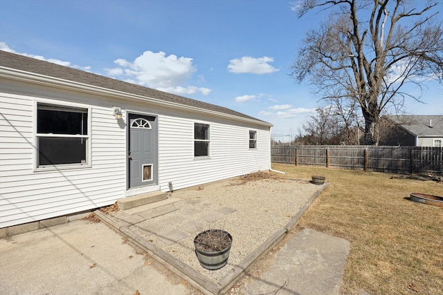 exterior space with a lawn, a patio, and a fenced backyard