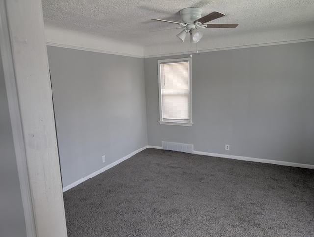870 Capitol Ave, Lincoln Park, MI 48146 - spare room featuring a textured ceiling, ceiling fan, dark carpet, and baseboards