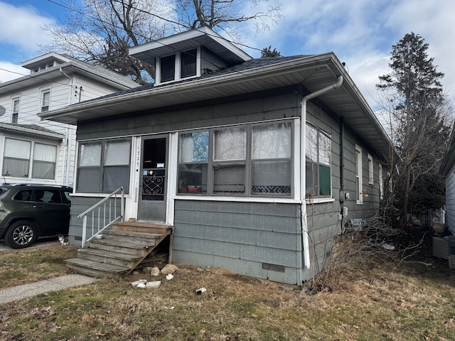 bungalow-style home with entry steps