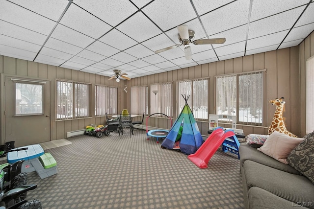 sunroom featuring a baseboard radiator, a paneled ceiling, and ceiling fan