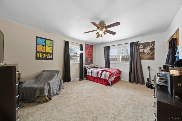 carpeted bedroom featuring a ceiling fan