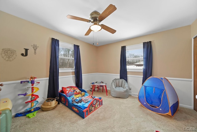 playroom with carpet flooring and ceiling fan