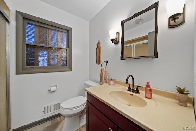 full bathroom featuring an enclosed shower, visible vents, toilet, and vanity