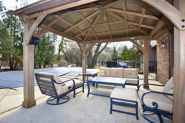 view of patio featuring a gazebo and an outdoor living space