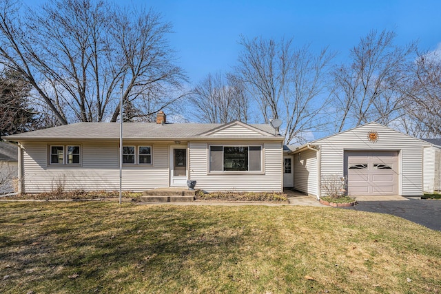 ranch-style house with aphalt driveway, a garage, a chimney, and a front yard