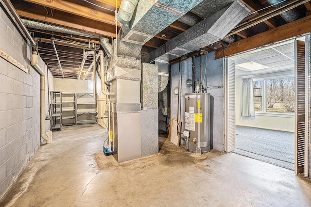 below grade area with concrete block wall, heating unit, and water heater