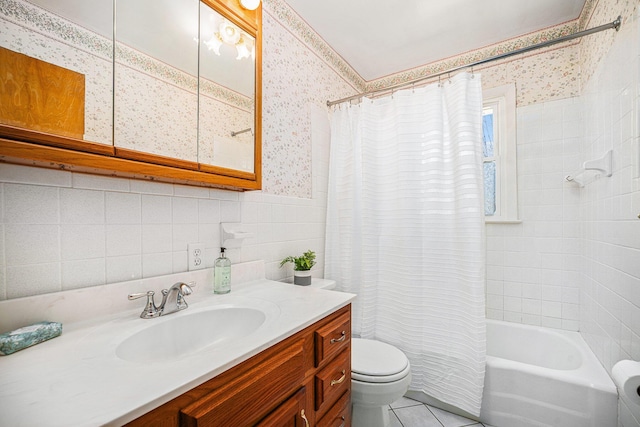 bathroom with shower / bath combo with shower curtain, toilet, wallpapered walls, tile walls, and tile patterned flooring