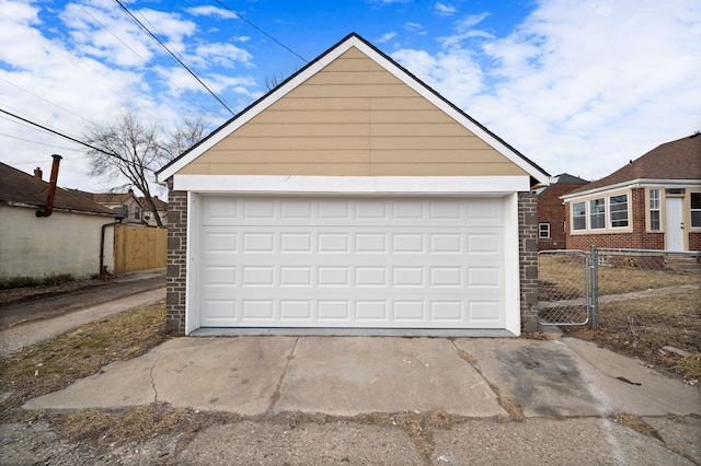 garage featuring a gate and fence