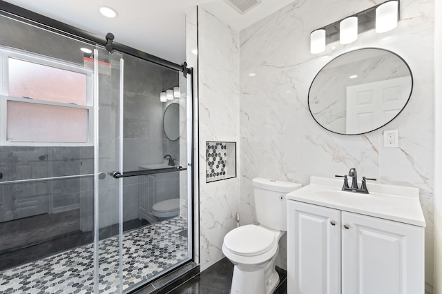 full bath with visible vents, toilet, a stall shower, tile walls, and vanity