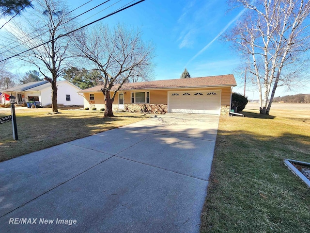 ranch-style home featuring a front lawn, an attached garage, stone siding, and concrete driveway