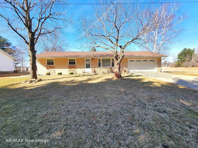 ranch-style home with stone siding, a front lawn, concrete driveway, and an attached garage