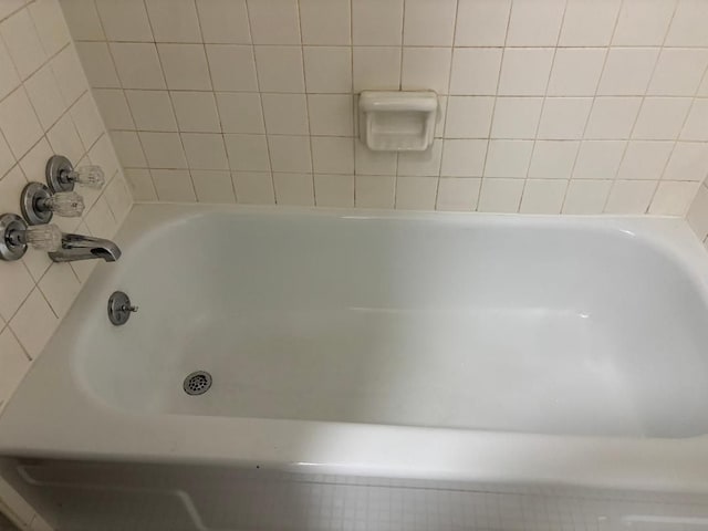 full bath featuring a bath