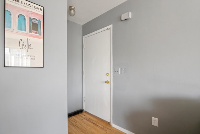 hallway with light wood-style flooring