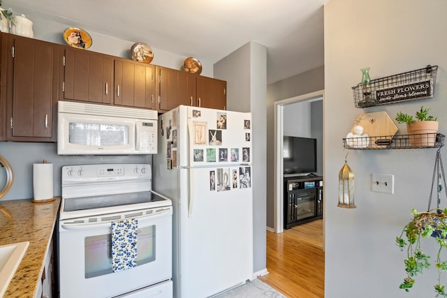 kitchen with white appliances and light countertops