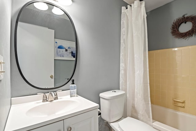 full bathroom with vanity, toilet, and shower / bath combo