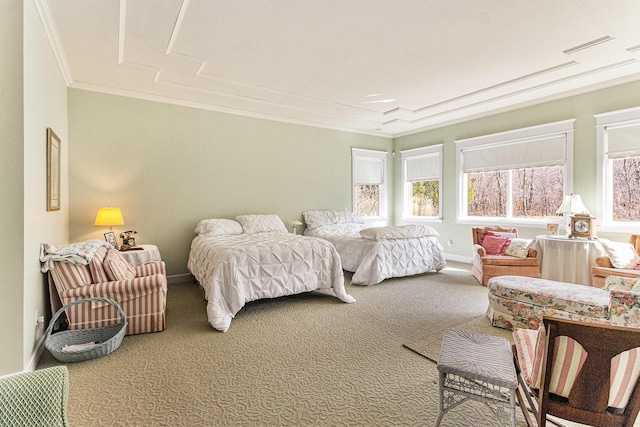 bedroom featuring crown molding, baseboards, and carpet floors