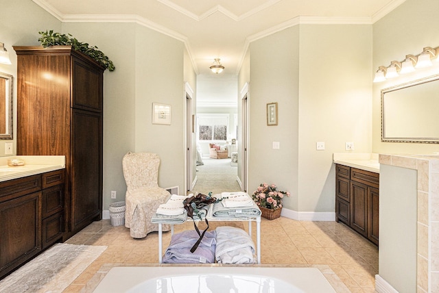 full bath with tile patterned flooring, a washtub, vanity, and baseboards