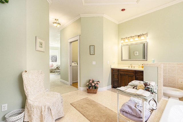 full bath with tile patterned floors, ornamental molding, a bathing tub, baseboards, and vanity