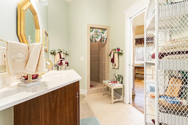 full bathroom with tile patterned floors, a shower stall, and vanity