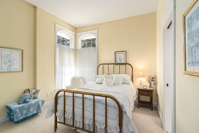 bedroom featuring baseboards and carpet floors