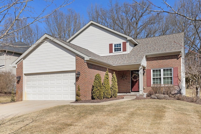 traditional-style house with brick siding, driveway, a shingled roof, and a garage