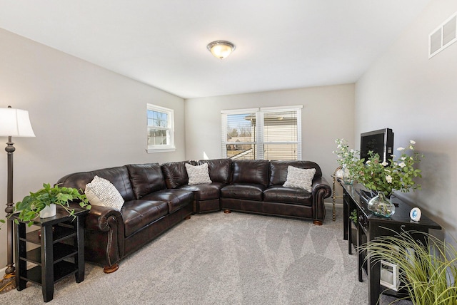 carpeted living room featuring visible vents