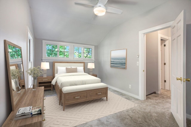 bedroom featuring vaulted ceiling, a ceiling fan, baseboards, and light carpet