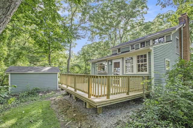 deck with an outbuilding and a storage shed