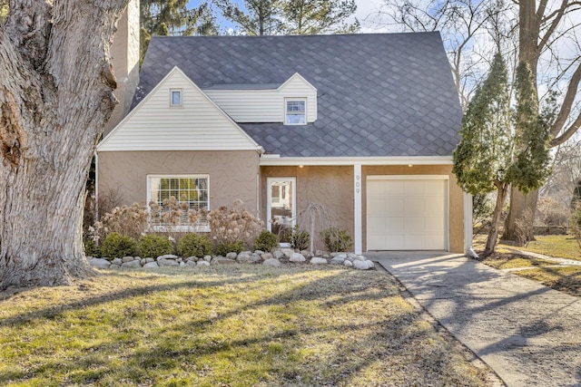 cape cod home featuring stucco siding and driveway