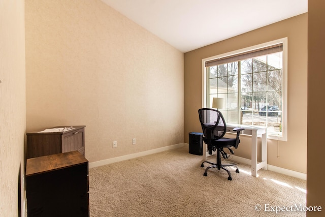 carpeted office space with baseboards