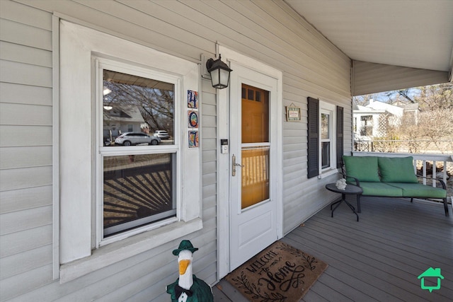 entrance to property featuring a porch