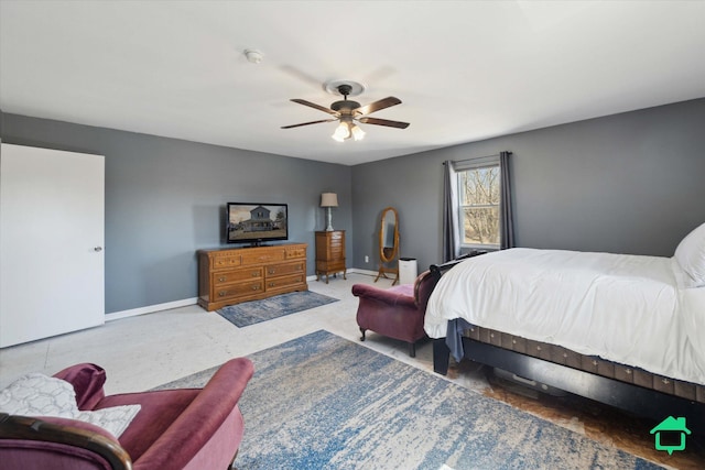 carpeted bedroom featuring ceiling fan and baseboards