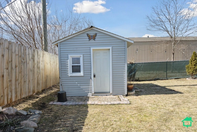 view of shed with a fenced backyard