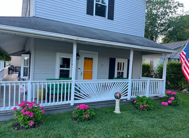 view of front of house featuring covered porch and roof with shingles