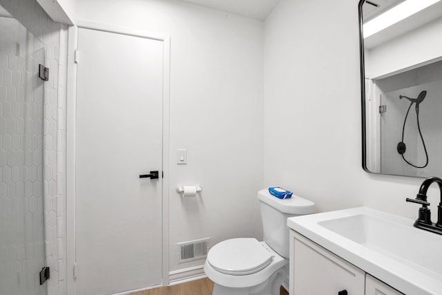 full bath with visible vents, toilet, vanity, and walk in shower