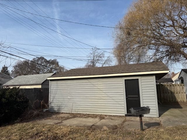 view of outbuilding with an outbuilding and fence