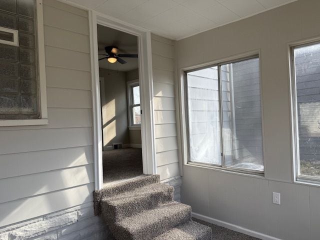 stairway featuring visible vents