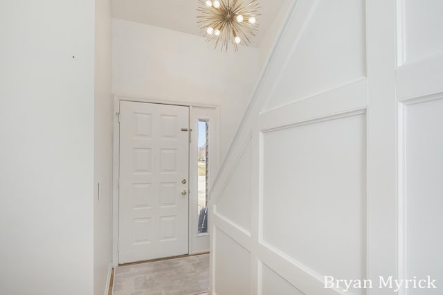 entryway featuring a notable chandelier