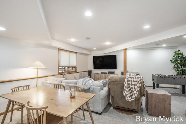 living area featuring recessed lighting, visible vents, and light colored carpet